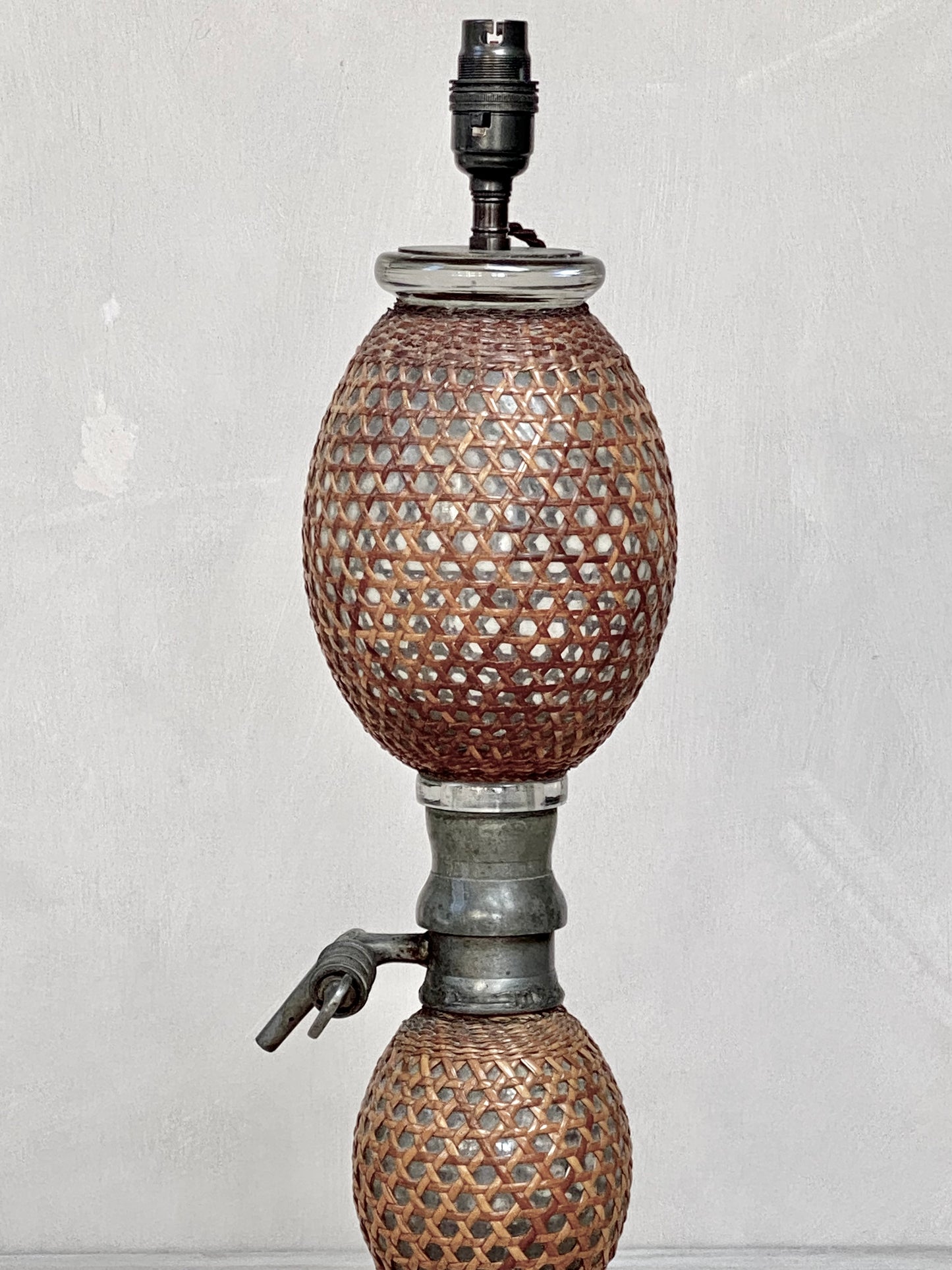 A vintage French soda syphon lamp base