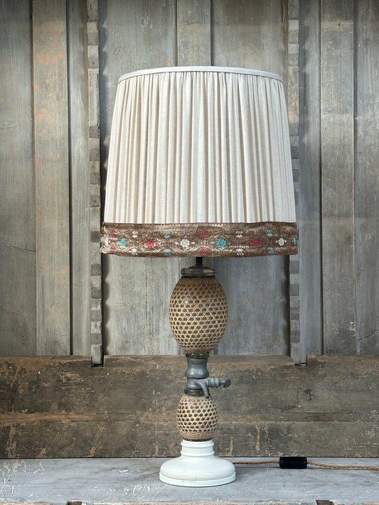 A vintage French soda syphon lamp base