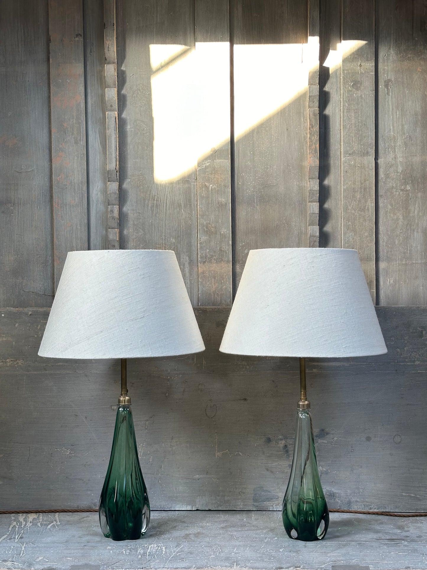 A pair of rare green glass table lamps, circa 1960